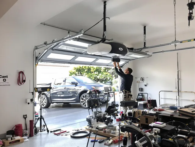 Wrentham Garage Door Repair specialist installing smart garage door opener system in Wrentham home