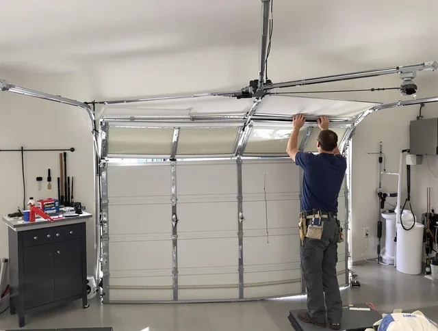 Wrentham Garage Door Repair specialist performing precise section replacement on Wrentham garage door